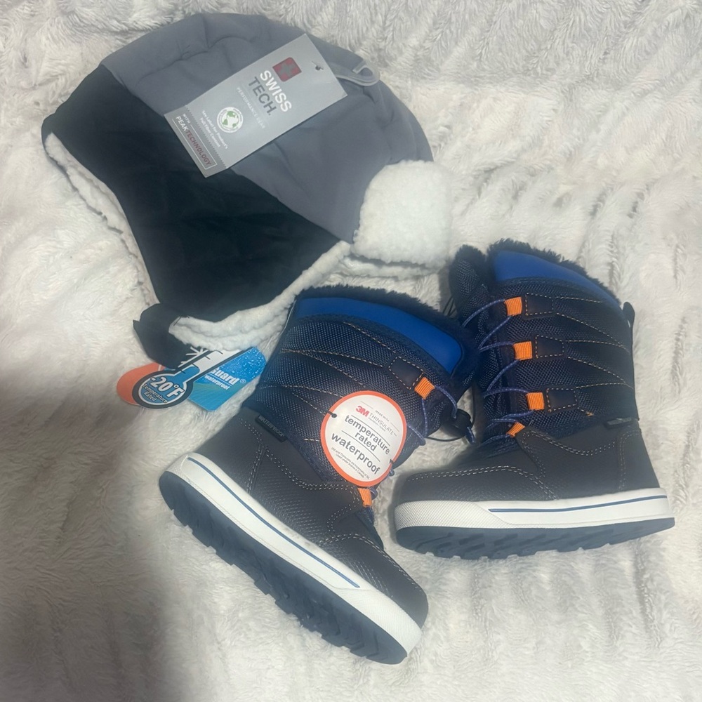 Toddler snow boots size 7 and Swiss Tech Toddler Trapper hat